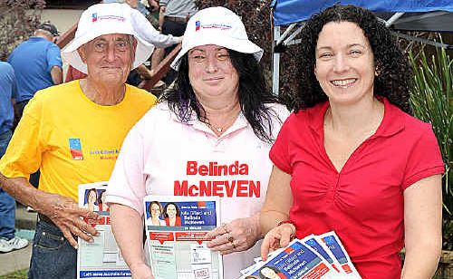 Belinda McNeven hands out how-to-vote cards with helpers Joe Endres and Debbie Carey at the pre-polling booth in Torquay. Belinda McNeven hands out how-to-vote cards with helpers Joe Endres and Debbie Carey at the pre-polling booth in Torquay.